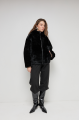 Stylish reversible black sheepskin coat with a hood made of natural sheepskin